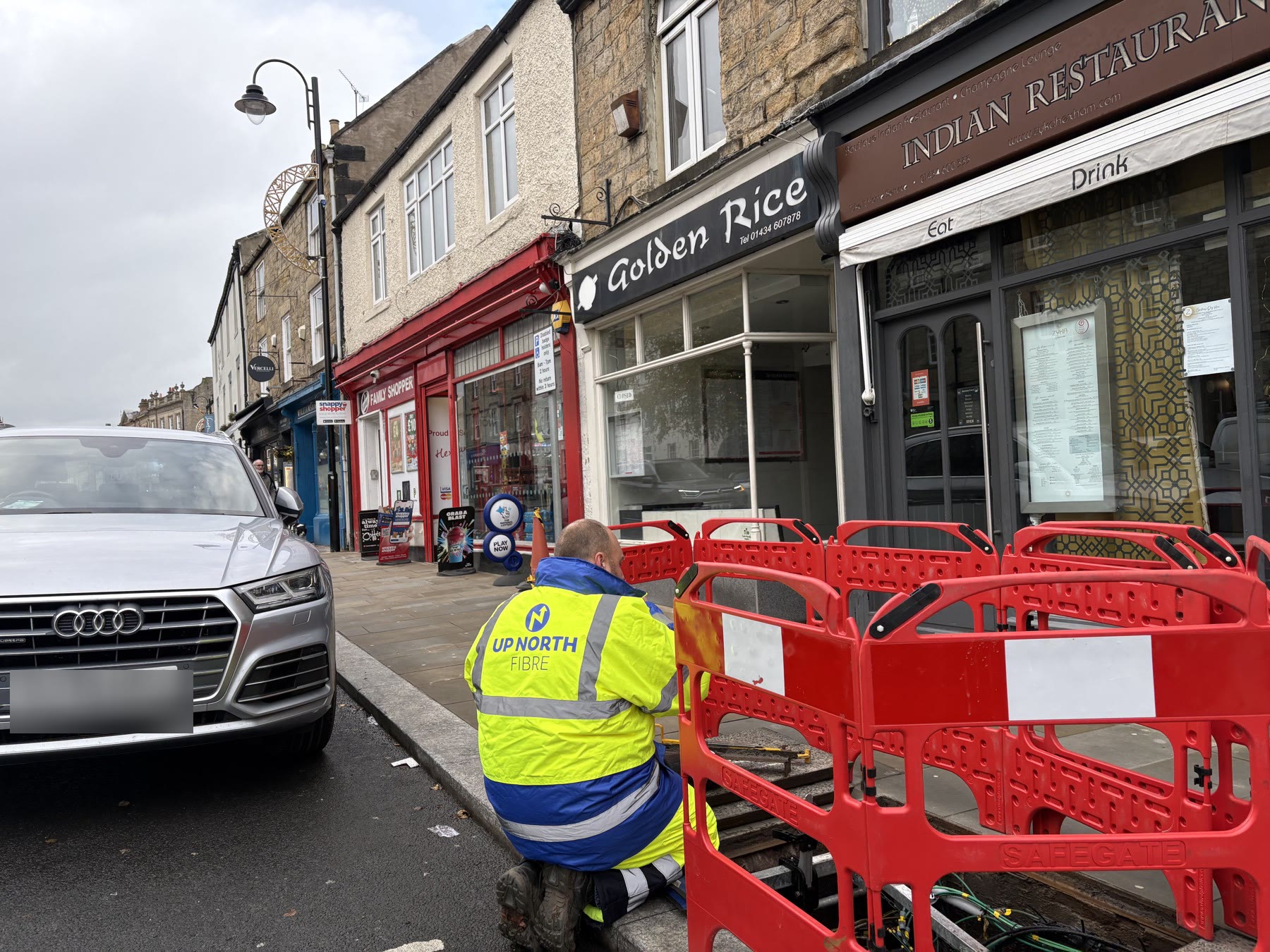 Up North Fibre engineer working behind safety barriers in Hexham town centre
